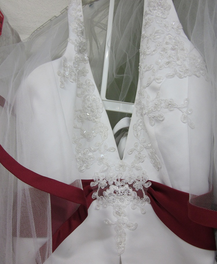 It is traditional white trimmed with maroon 